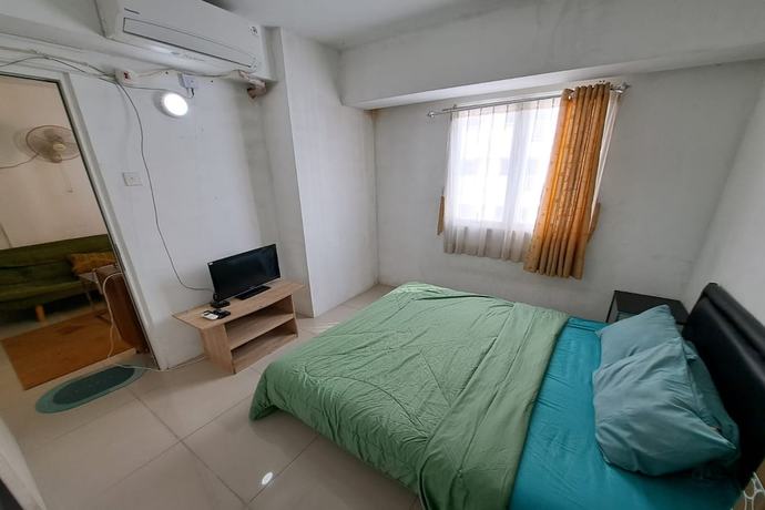 Imagen de la habitación del Hotel Oyo 93364 Apartement Grand Sentraland By King Property. Foto 17