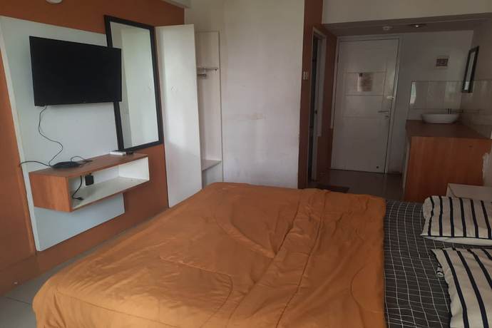 Imagen de la habitación del Hotel Oyo 93366 Apartement Grand Sentraland By Rai Property. Foto 6