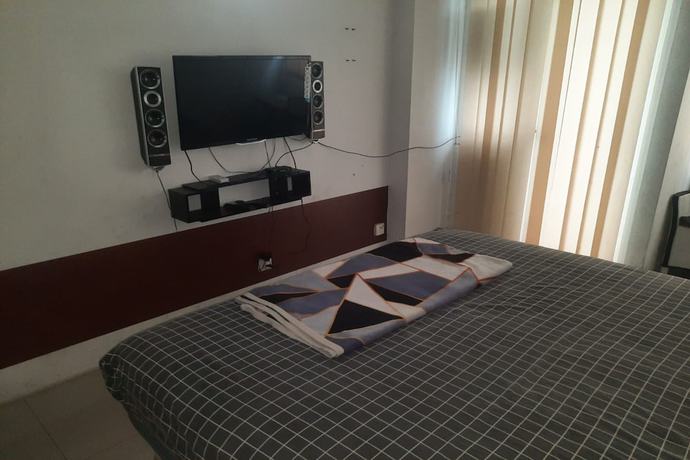 Imagen de la habitación del Hotel Oyo 93366 Apartement Grand Sentraland By Rai Property. Foto 11