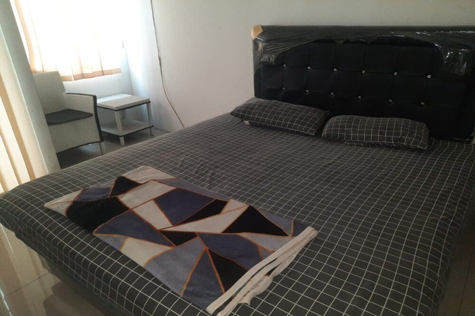 Imagen de la habitación del Hotel Oyo 93386 Apartemen Grand Sentraland By Mira. Foto 4