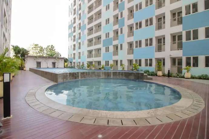 Imagen de la piscina del Hotel Oyo 93386 Apartemen Grand Sentraland By Mira. Foto 16