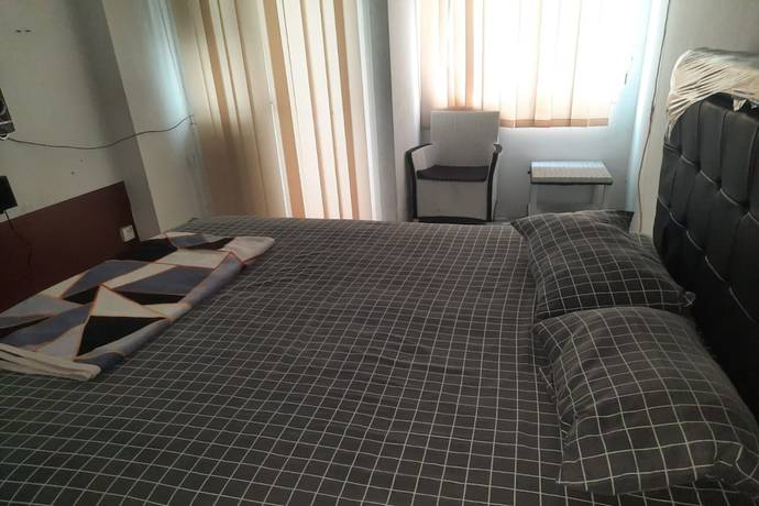 Imagen de la habitación del Hotel Oyo 93386 Apartemen Grand Sentraland By Mira. Foto 6