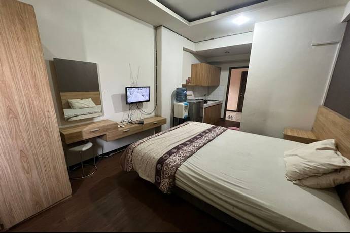 Imagen de la habitación del Hotel Oyo 93424 Apartemen The Suite Metro By Salman. Foto 6