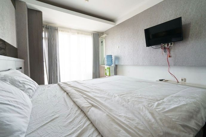 Imagen de la habitación del Hotel Oyo 93424 Apartemen The Suite Metro By Salman. Foto 12