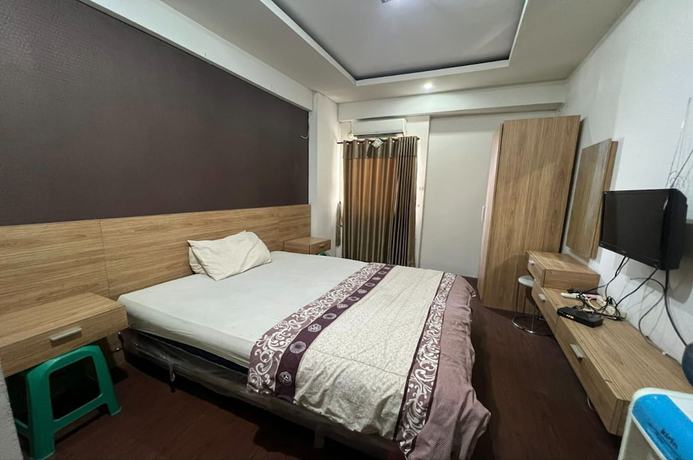 Imagen de la habitación del Hotel Oyo 93424 Apartemen The Suite Metro By Salman. Foto 15