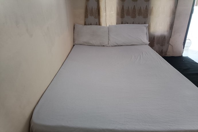 Imagen de la habitación del Hotel Oyo 93435 Yuda Family Homestay. Foto 9