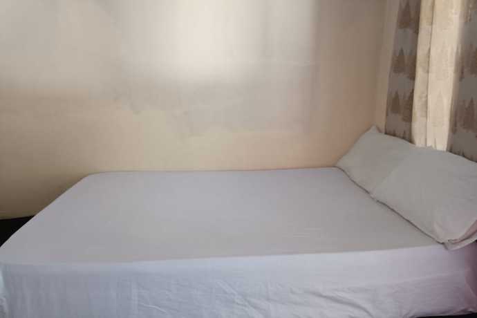 Imagen de la habitación del Hotel Oyo 93435 Yuda Family Homestay. Foto 13