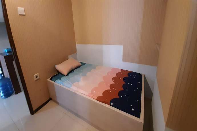 Imagen de la habitación del Hotel Oyo 93439 The Suites Metro By Interindo. Foto 3