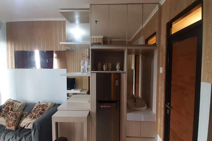 Imagen de la habitación del Hotel Oyo 93439 The Suites Metro By Interindo. Foto 4