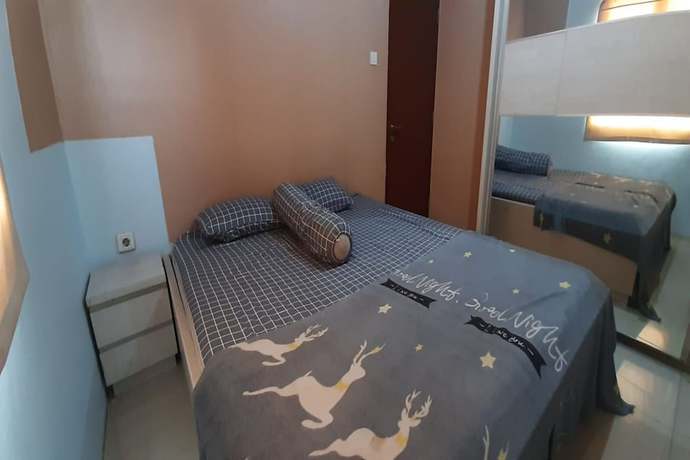 Imagen de la habitación del Hotel Oyo 93439 The Suites Metro By Interindo. Foto 6