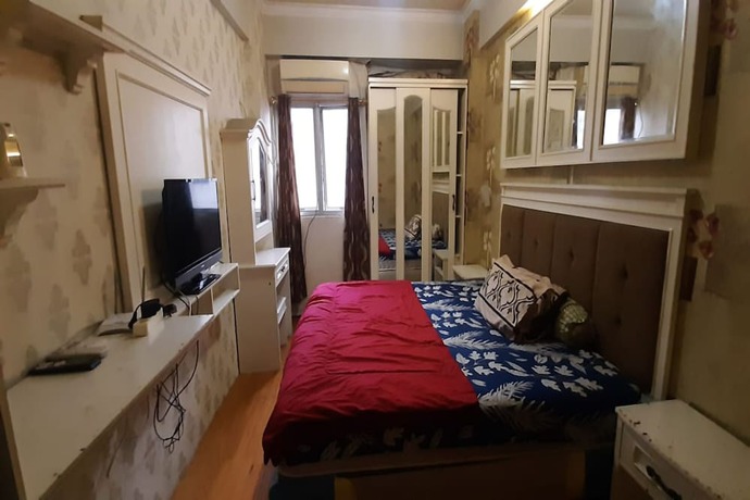 Imagen de la habitación del Hotel Oyo 93439 The Suites Metro By Interindo. Foto 10