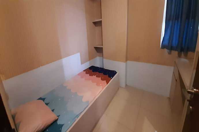 Imagen de la habitación del Hotel Oyo 93439 The Suites Metro By Interindo. Foto 11