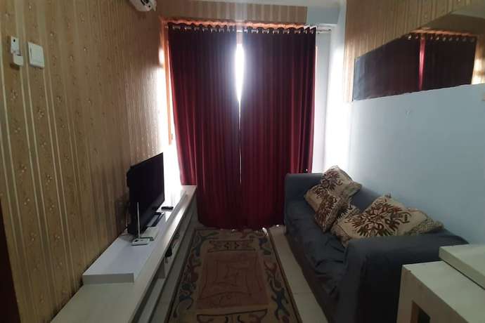 Imagen de la habitación del Hotel Oyo 93439 The Suites Metro By Interindo. Foto 14