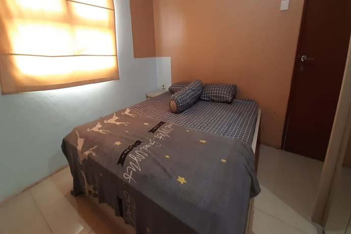 Imagen de la habitación del Hotel Oyo 93439 The Suites Metro By Interindo. Foto 16