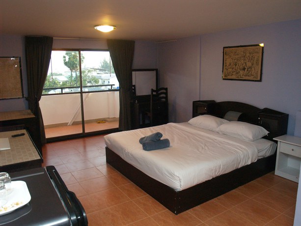 Imagen de la habitación del Hotel Oyo 963 Sunshine Guesthouse. Foto 8