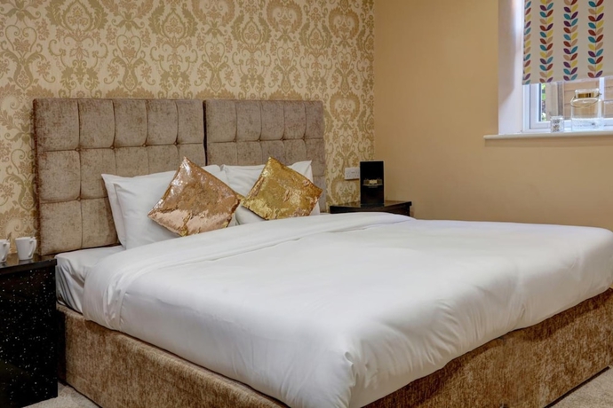 Imagen de la habitación del Hotel Oyo Baylis House. Foto 6