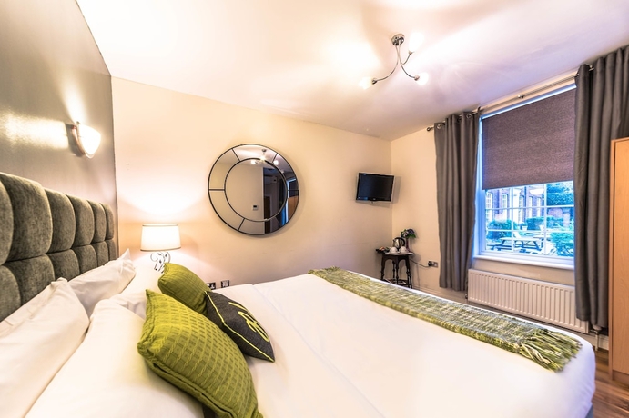 Imagen de la habitación del Hotel Oyo Baylis House. Foto 12