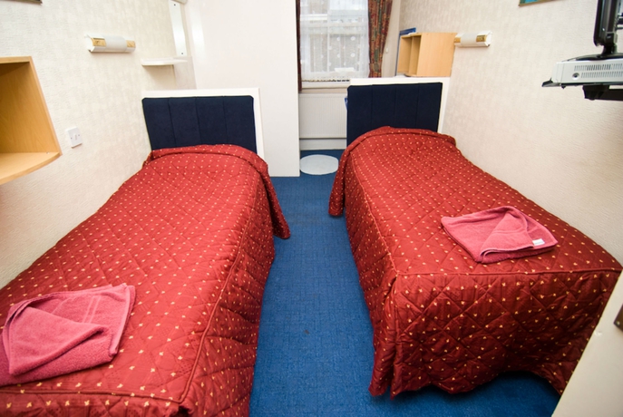 Imagen de la habitación del Hotel Oyo Boston Court. Foto 10