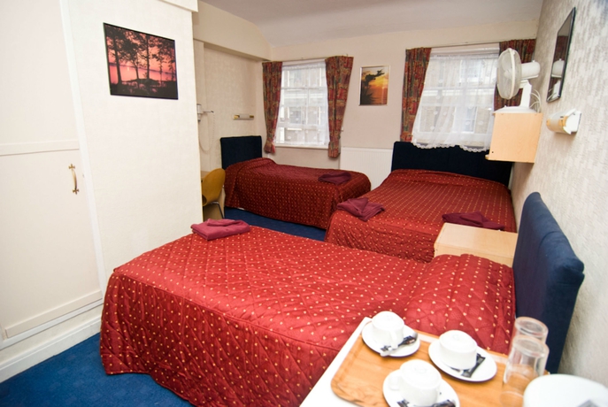 Imagen de la habitación del Hotel Oyo Boston Court. Foto 11