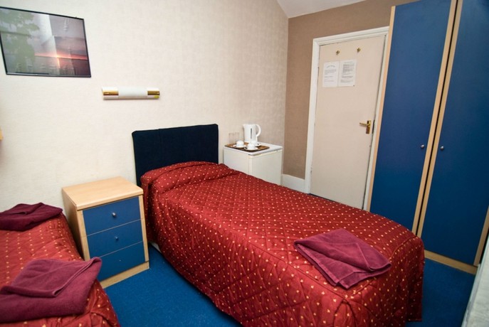 Imagen de la habitación del Hotel Oyo Boston Court. Foto 13