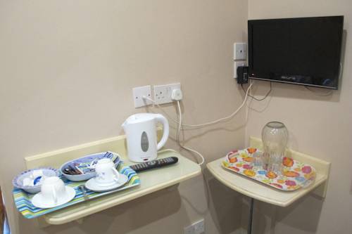 Imagen de la habitación del Hotel Oyo Bostons Manor. Foto 5