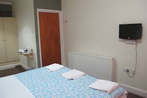 Imagen de la habitación del Hotel Oyo Bostons Manor. Foto 8