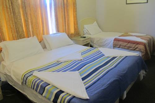 Imagen de la habitación del Hotel Oyo Bostons Manor. Foto 9