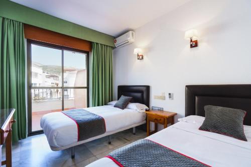 Imagen de la habitación del Hotel Oyo El Ancla. Foto 7