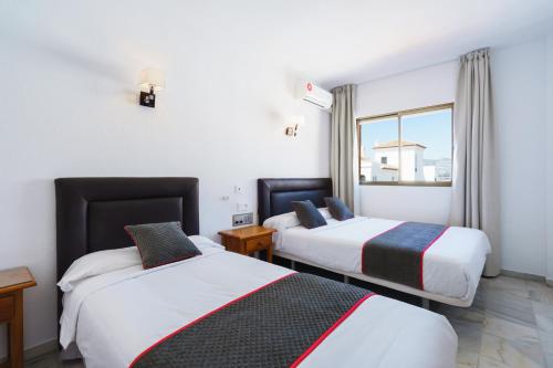 Imagen de la habitación del Hotel Oyo El Ancla. Foto 10