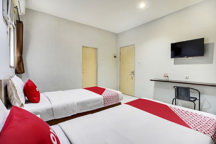 Imagen de la habitación del Hotel Oyo Flagship 91130 99 Lodaya. Foto 3