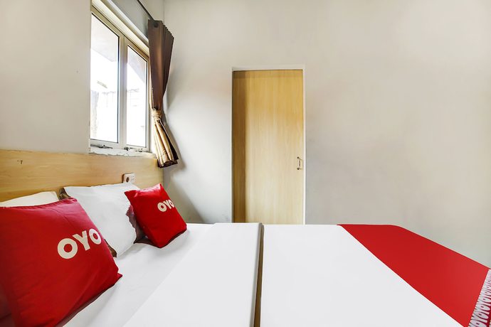 Imagen de la habitación del Hotel Oyo Flagship 91130 99 Lodaya. Foto 5