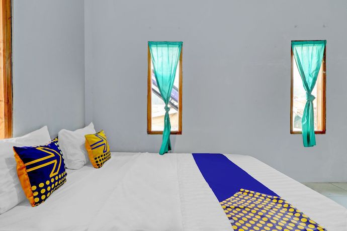 Imagen de la habitación del Hotel Oyo Homes 90849 Cibeunying Homestay Cibodas Maribaya. Foto 3