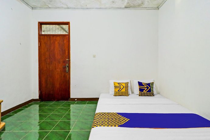 Imagen de la habitación del Hotel Oyo Homes 90849 Cibeunying Homestay Cibodas Maribaya. Foto 6