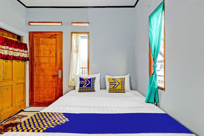 Imagen de la habitación del Hotel Oyo Homes 90849 Cibeunying Homestay Cibodas Maribaya. Foto 7