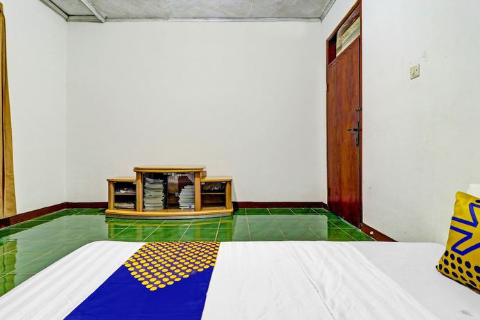 Imagen de la habitación del Hotel Oyo Homes 90849 Cibeunying Homestay Cibodas Maribaya. Foto 10