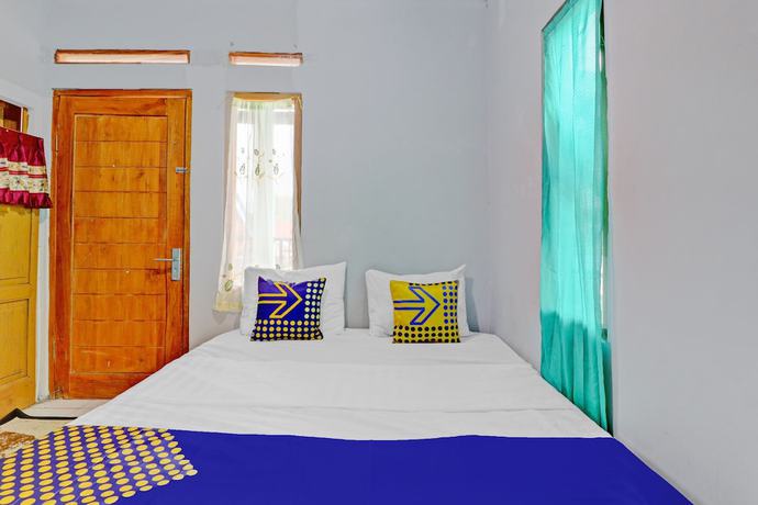 Imagen de la habitación del Hotel Oyo Homes 90849 Cibeunying Homestay Cibodas Maribaya. Foto 12