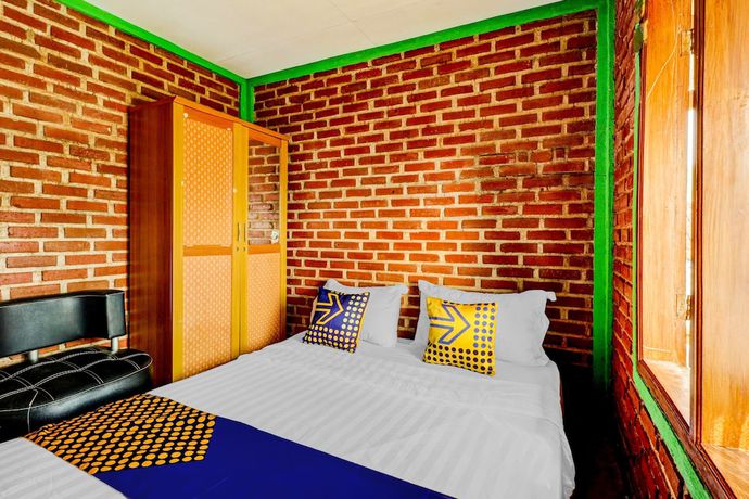 Imagen de la habitación del Hotel Oyo Homes 90850 Cibeunying Eco Tourism Homestay Cibodas Maribaya 2. Foto 10