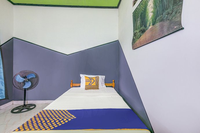 Imagen de la habitación del Hotel Oyo Homes 90987 Desa Wisata Gabugan Syariah. Foto 8