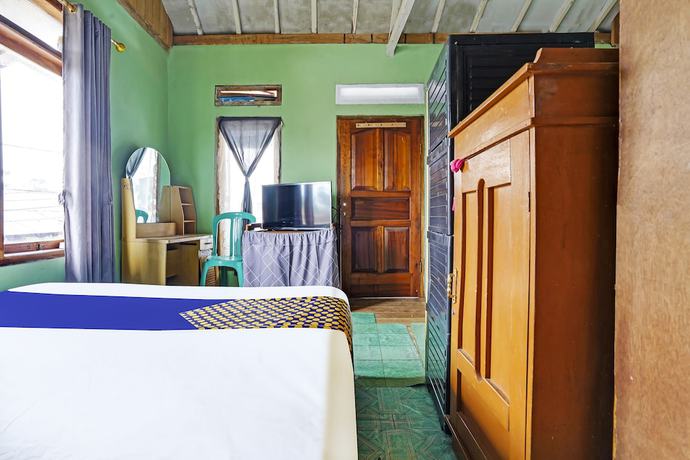 Imagen de la habitación del Hotel Oyo Homes 91011 Eco Tourism Desa Cibodas Areng 1 Syariah. Foto 3