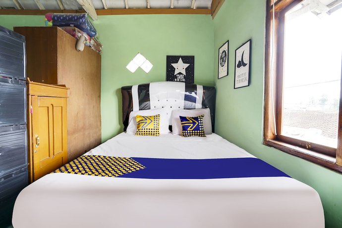 Imagen de la habitación del Hotel Oyo Homes 91011 Eco Tourism Desa Cibodas Areng 1 Syariah. Foto 4