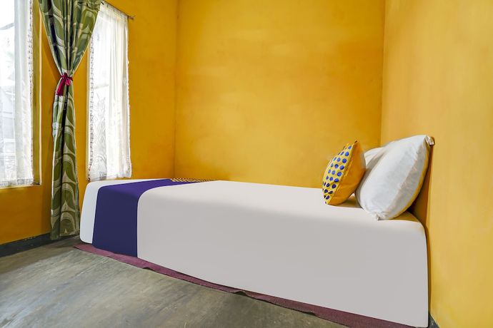 Imagen de la habitación del Hotel Oyo Homes 91011 Eco Tourism Desa Cibodas Areng 1 Syariah. Foto 5