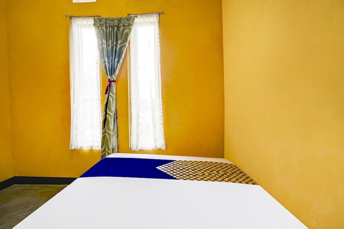 Imagen de la habitación del Hotel Oyo Homes 91011 Eco Tourism Desa Cibodas Areng 1 Syariah. Foto 11