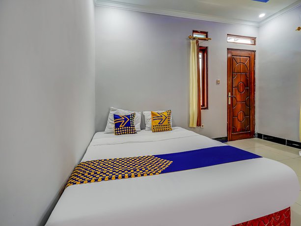Imagen de la habitación del Hotel Oyo Homes 91014 Eco Tourism Desa Cibodas Areng 2 Syariah. Foto 2