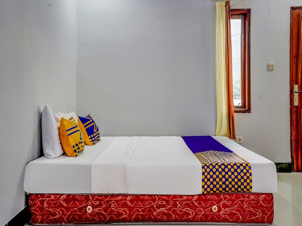 Imagen de la habitación del Hotel Oyo Homes 91014 Eco Tourism Desa Cibodas Areng 2 Syariah. Foto 3