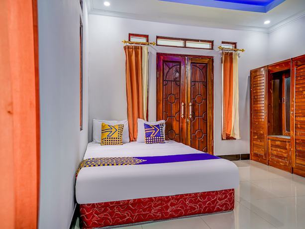 Imagen de la habitación del Hotel Oyo Homes 91014 Eco Tourism Desa Cibodas Areng 2 Syariah. Foto 4