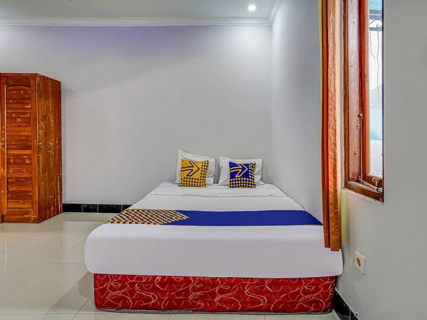 Imagen de la habitación del Hotel Oyo Homes 91014 Eco Tourism Desa Cibodas Areng 2 Syariah. Foto 5
