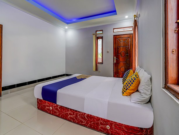 Imagen de la habitación del Hotel Oyo Homes 91014 Eco Tourism Desa Cibodas Areng 2 Syariah. Foto 6