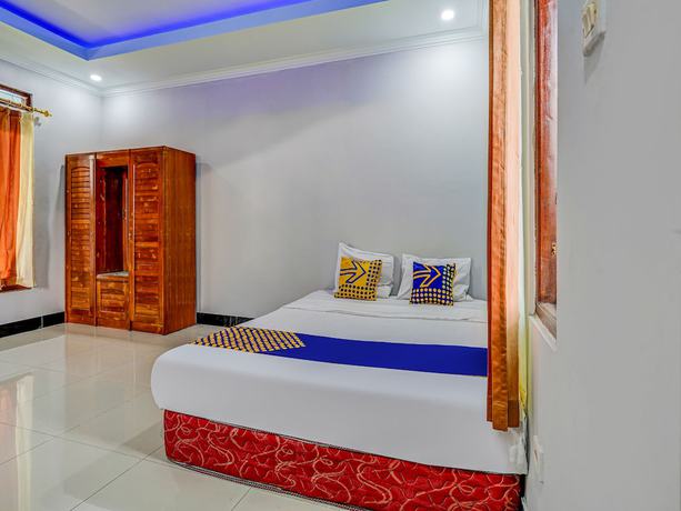 Imagen de la habitación del Hotel Oyo Homes 91014 Eco Tourism Desa Cibodas Areng 2 Syariah. Foto 7
