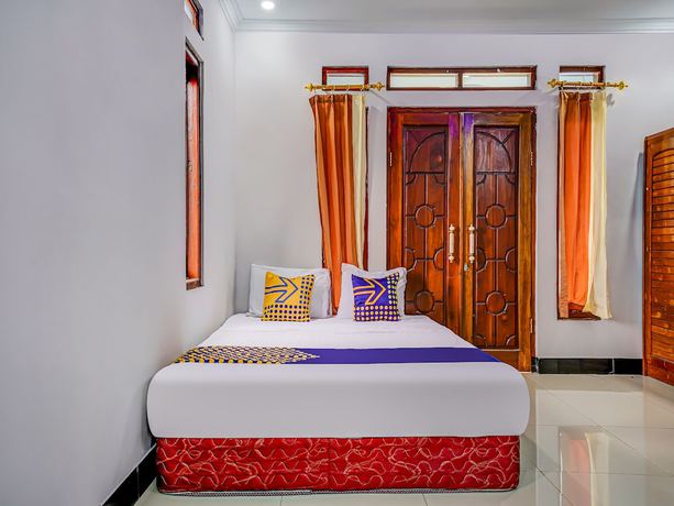 Imagen de la habitación del Hotel Oyo Homes 91014 Eco Tourism Desa Cibodas Areng 2 Syariah. Foto 8