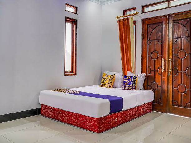 Imagen de la habitación del Hotel Oyo Homes 91014 Eco Tourism Desa Cibodas Areng 2 Syariah. Foto 9